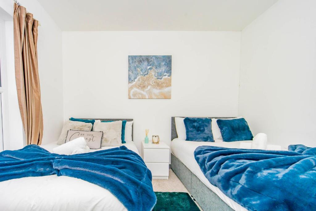 En eller flere senger på et rom på Modern 3 bed flat in quiet BRIGHTON location OM18