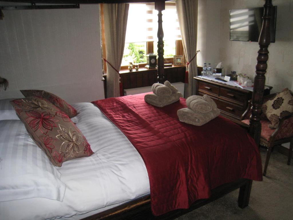 Postel nebo postele na pokoji v ubytování Rosebud Cottage Guest House