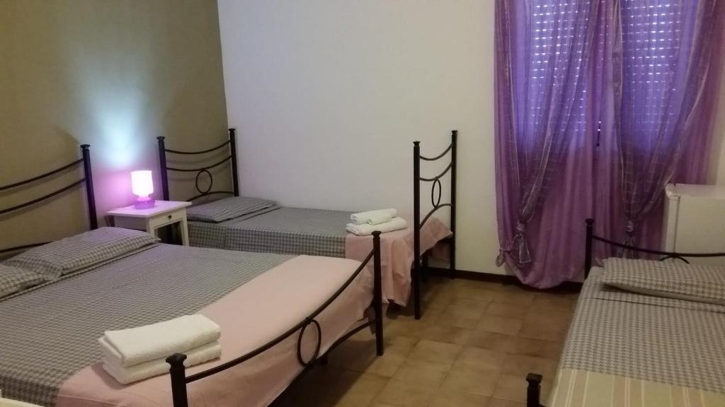 Postel nebo postele na pokoji v ubytování B&B Salvatore Lido di Noto