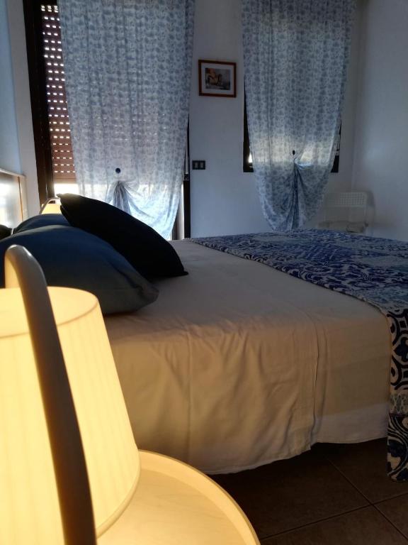 Postel nebo postele na pokoji v ubytování B&B Salvatore Lido di Noto