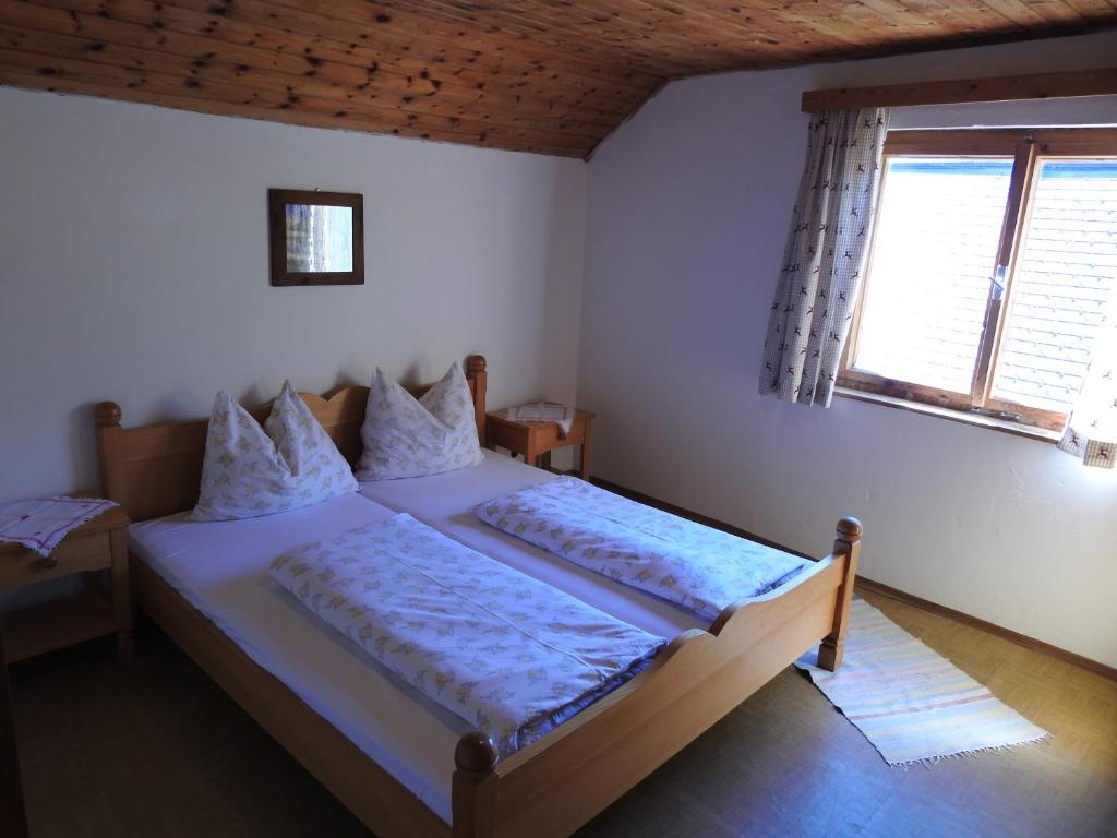 Postel nebo postele na pokoji v ubytování Zauneralm