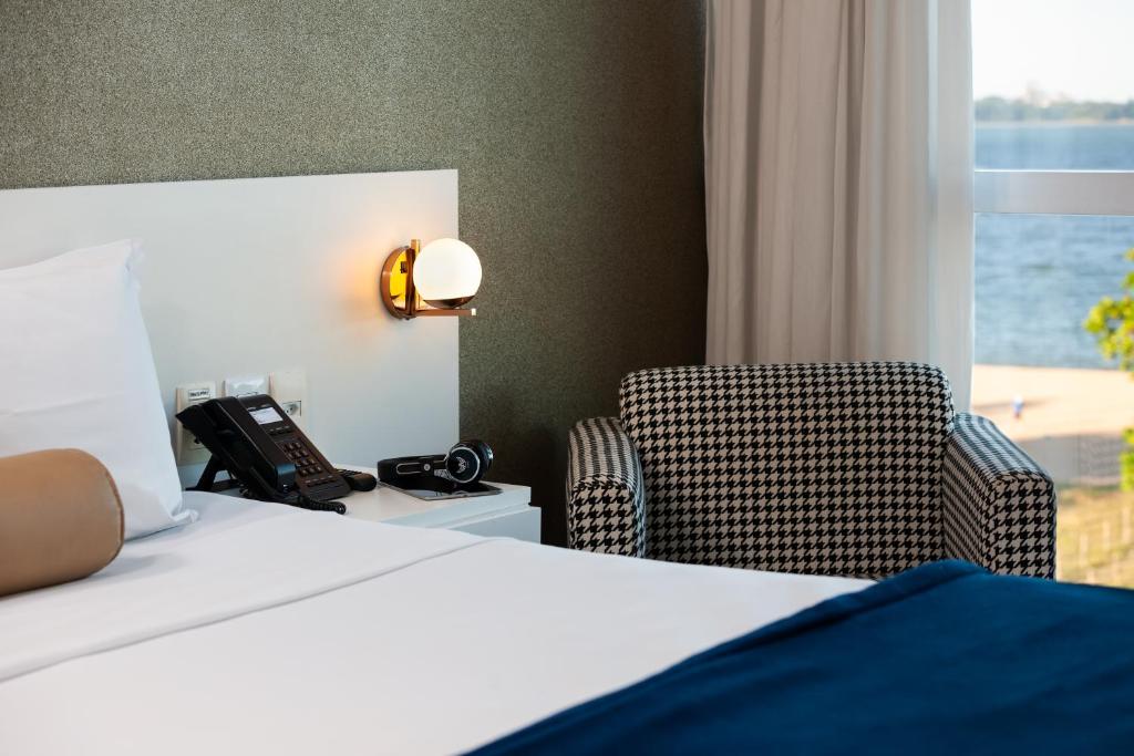 Postel nebo postele na pokoji v ubytování Píer Vitória Hotel