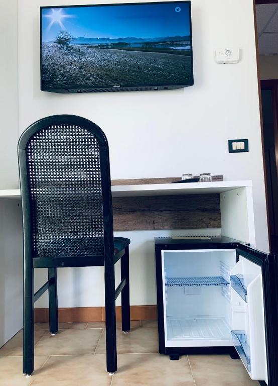 TV a/nebo společenská místnost v ubytování Hotel Al Capitano