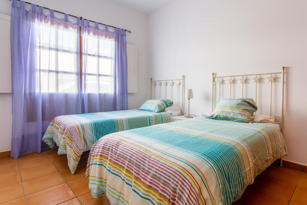 Postel nebo postele na pokoji v ubytování Casa Jardín