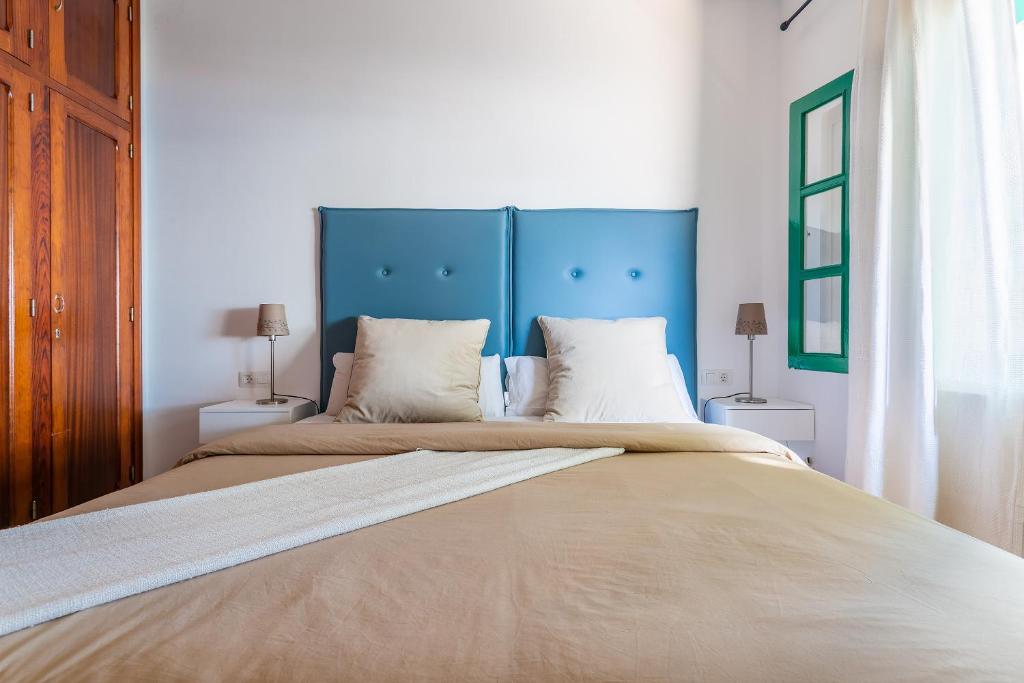 Postel nebo postele na pokoji v ubytování Casa Jardín