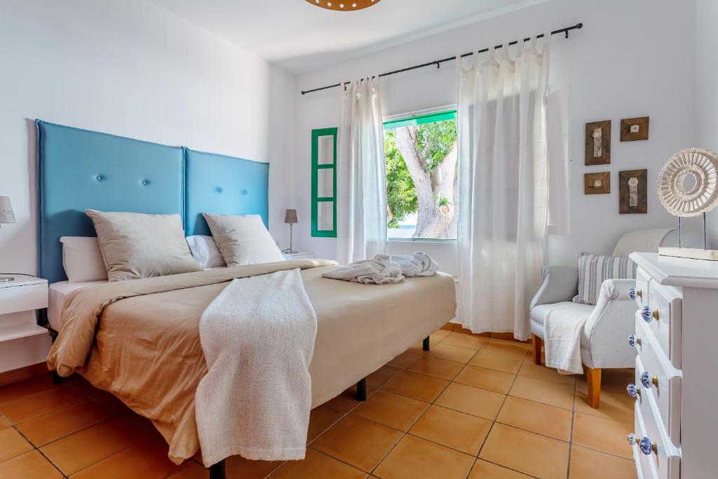 Postel nebo postele na pokoji v ubytování Casa Jardín