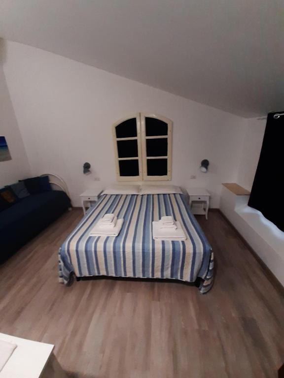 Postel nebo postele na pokoji v ubytování Cuscino e Cappuccino B&B
