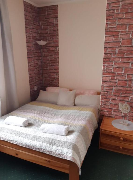 Posteľ alebo postele v izbe v ubytovaní vila Happy
