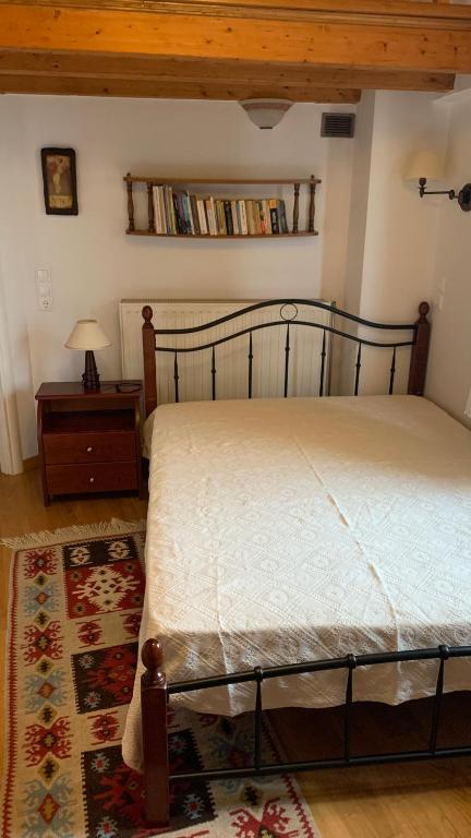 Postel nebo postele na pokoji v ubytování Ξύλο & Παράδοση