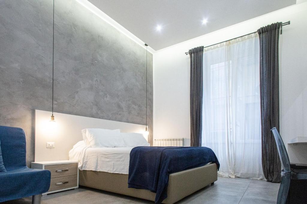 A bed or beds in a room at Casa Nora Napoli