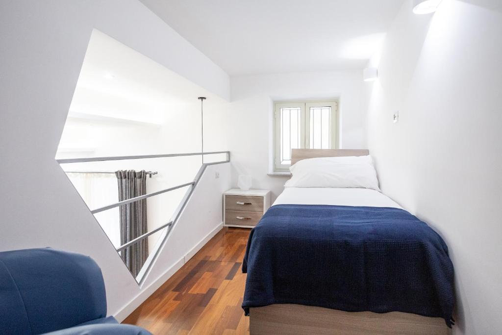 A bed or beds in a room at Casa Nora Napoli
