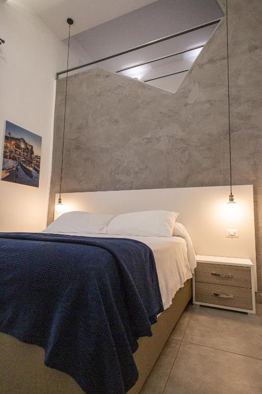 A bed or beds in a room at Casa Nora Napoli