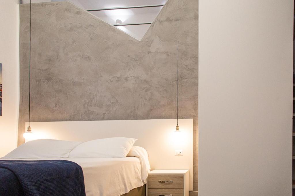 A bed or beds in a room at Casa Nora Napoli
