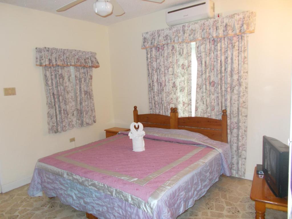 Postel nebo postele na pokoji v ubytování Paradise Inn
