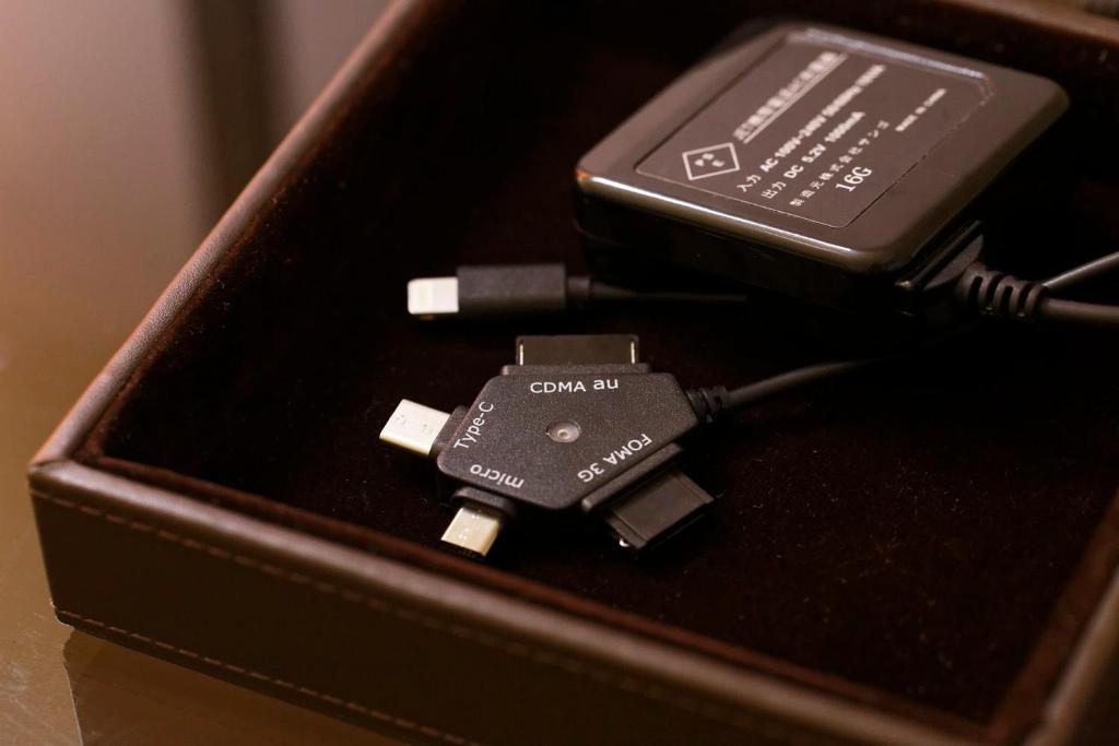 a cell phone in a box on a table at Hotel Forza Osaka Namba in Osaka