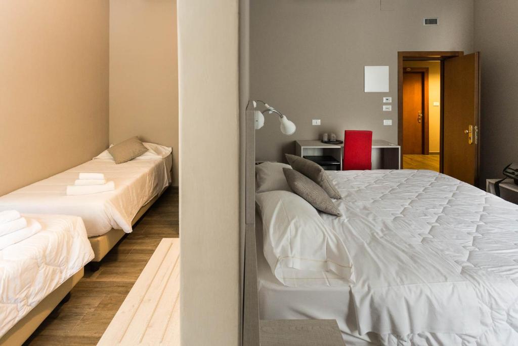 Postel nebo postele na pokoji v ubytování Hotel Terme di Frasassi