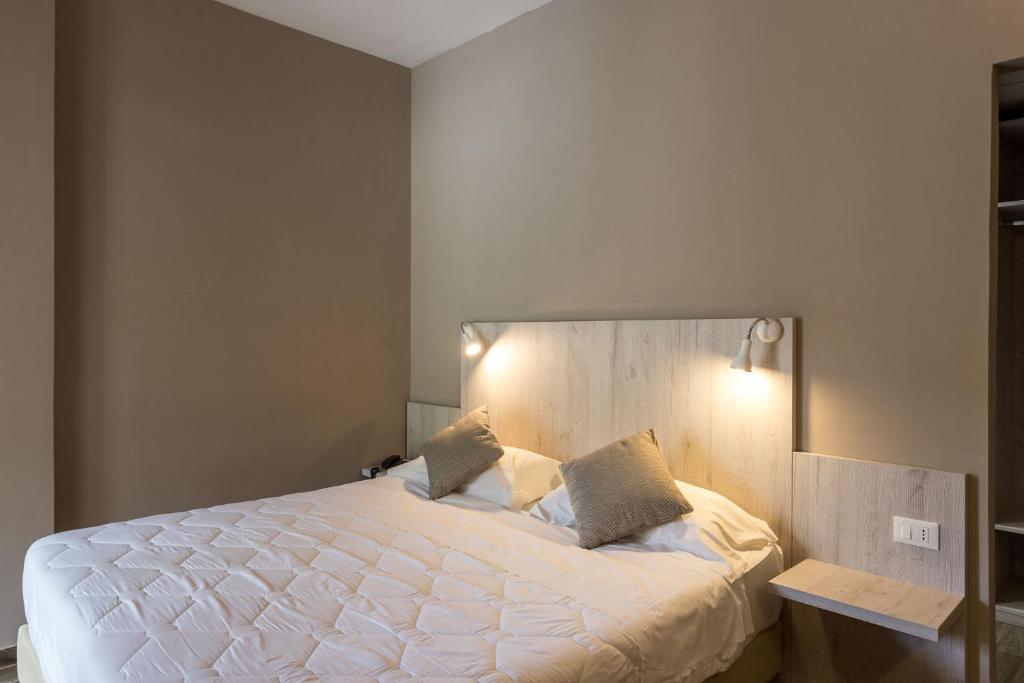Postel nebo postele na pokoji v ubytování Hotel Terme di Frasassi
