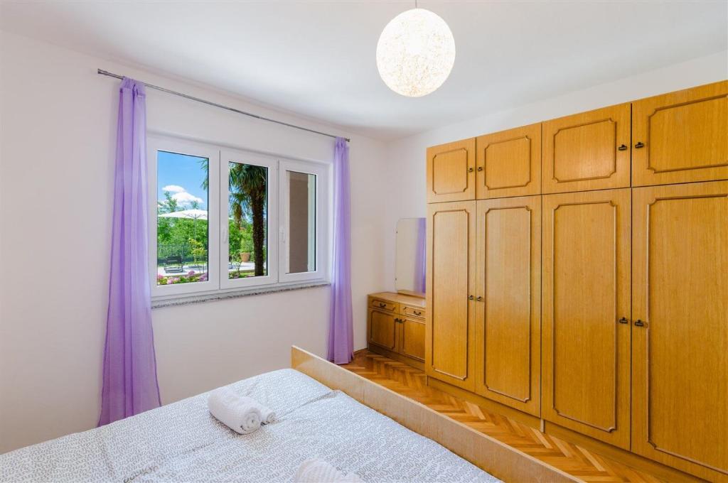 Postel nebo postele na pokoji v ubytování Apartments Rajna
