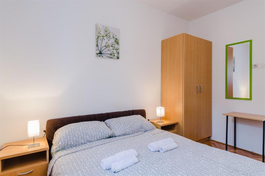 Postel nebo postele na pokoji v ubytování Apartments Rajna