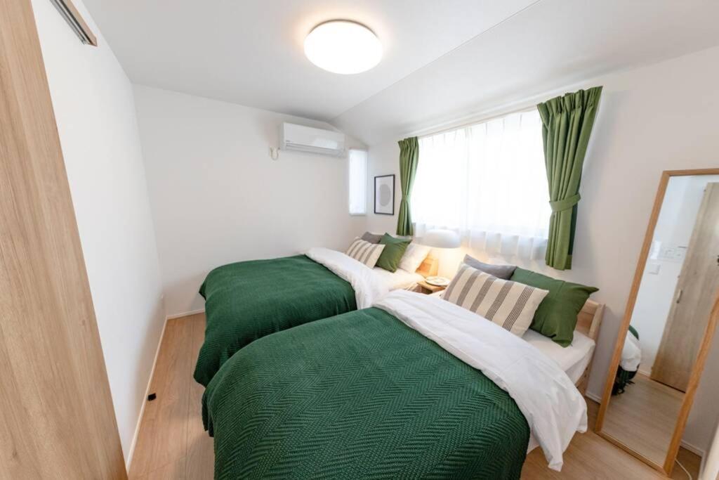 Postel nebo postele na pokoji v ubytování Sky Tree house