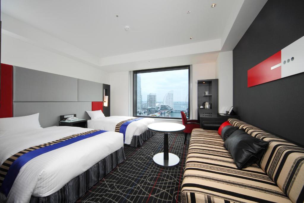 Postel nebo postele na pokoji v ubytování New Otani Inn Yokohama Premium