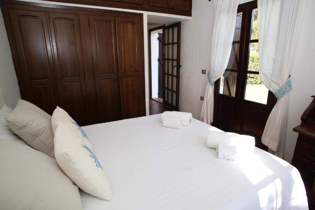 Posteľ alebo postele v izbe v ubytovaní Villa con discesa privata a mare