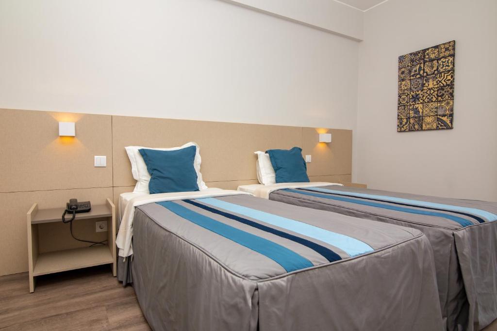 Postel nebo postele na pokoji v ubytování Hotel do Parque