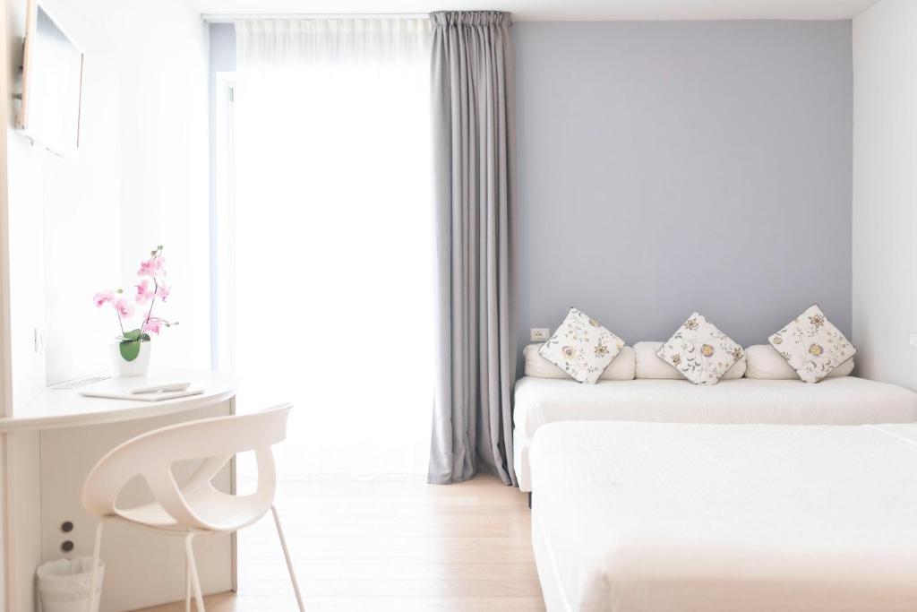 Postelja oz. postelje v sobi nastanitve Aromi Piccolo Hotel
