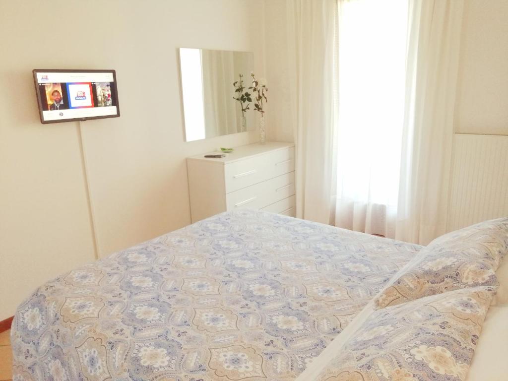 Łóżko lub łóżka w pokoju w obiekcie Casa Roberto