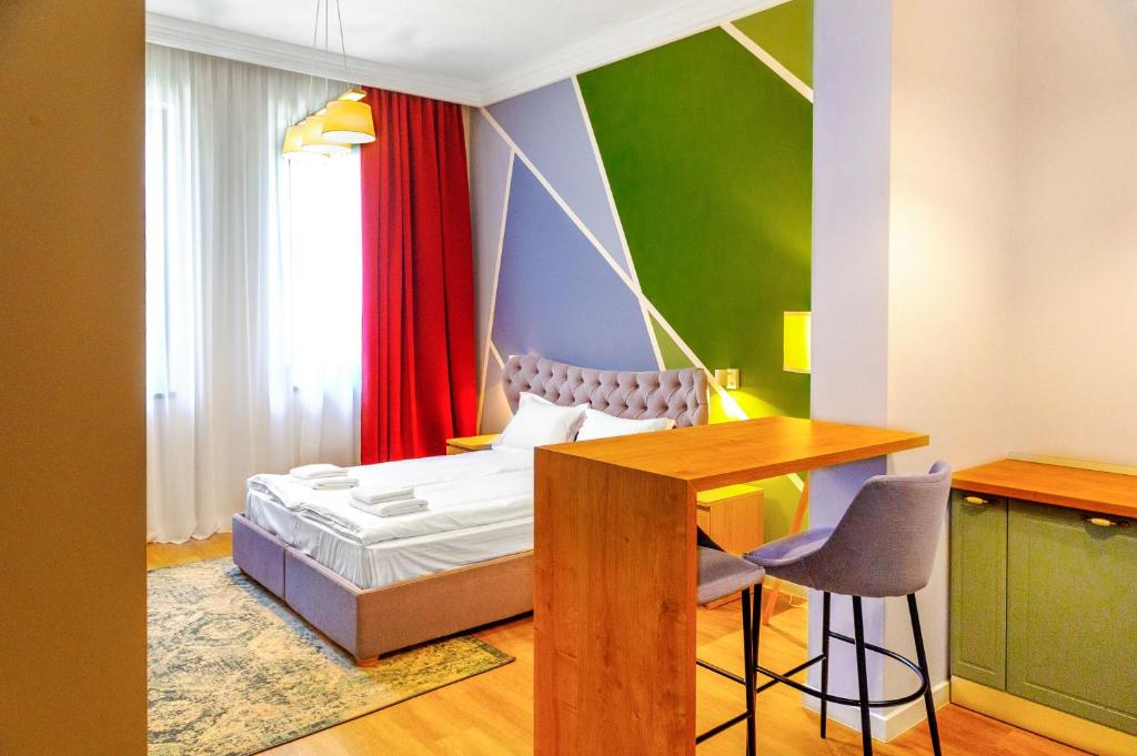 מיטה או מיטות בחדר ב-H11 Downtown Apartments