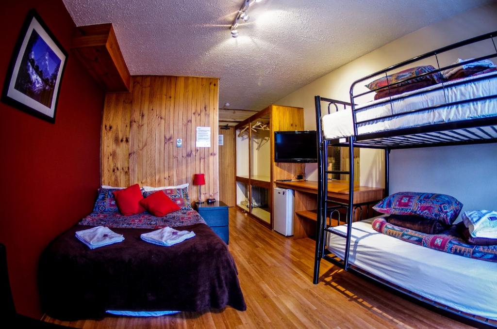 Кровать или кровати в номере Alpine Retreat Mt Buller