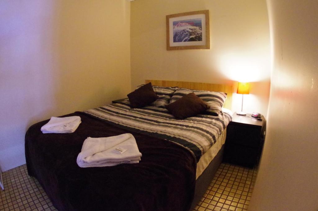 Кровать или кровати в номере Alpine Retreat Mt Buller