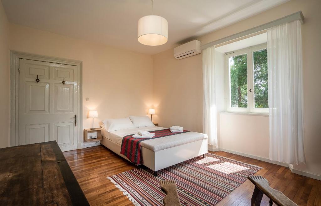 Postel nebo postele na pokoji v ubytování Villa Kefalomandouko