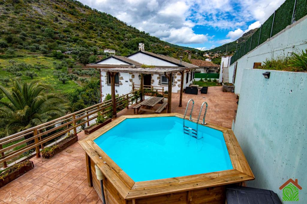 a swimming pool on the balcony of a house at Casa Rural Santa Bárbara in El Real de San Vicente