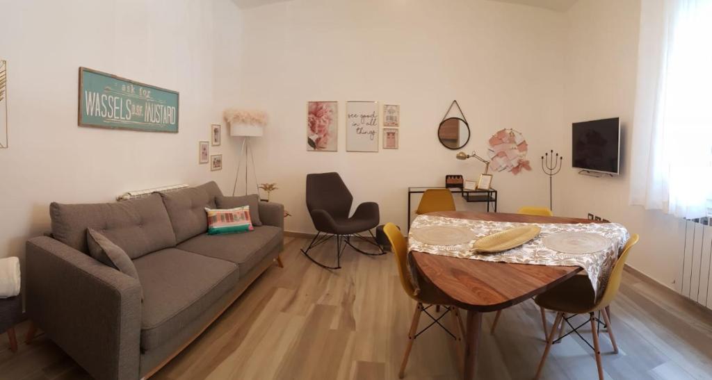 a living room with a couch and a table at La Gubbiata in Bologna