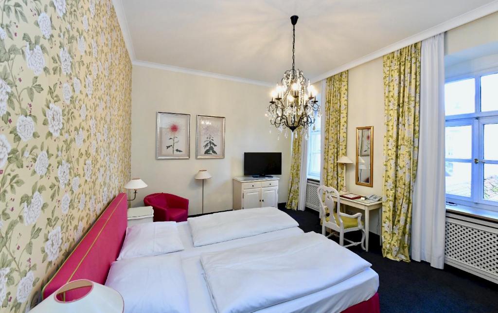 Postel nebo postele na pokoji v ubytování Hotel Bischofshof am Dom