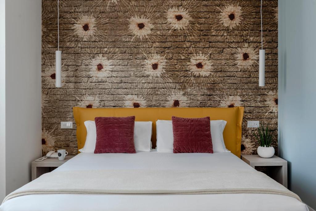 Postel nebo postele na pokoji v ubytování Hotel Delle Rose