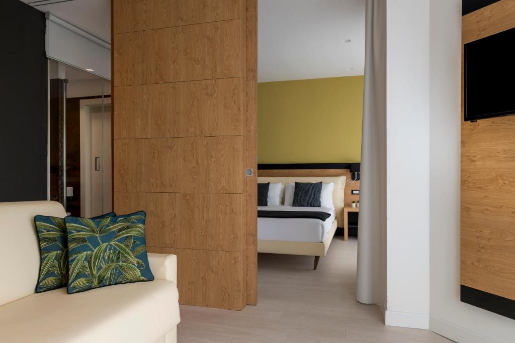 Postel nebo postele na pokoji v ubytování Hotel Delle Rose