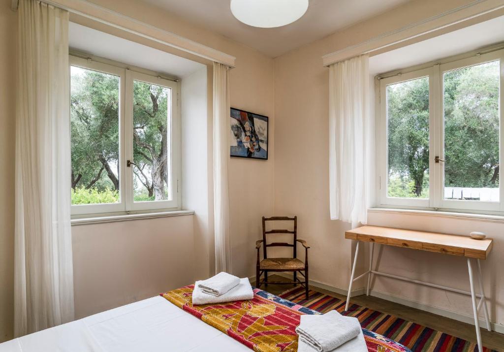 Postel nebo postele na pokoji v ubytování Villa Kefalomandouko