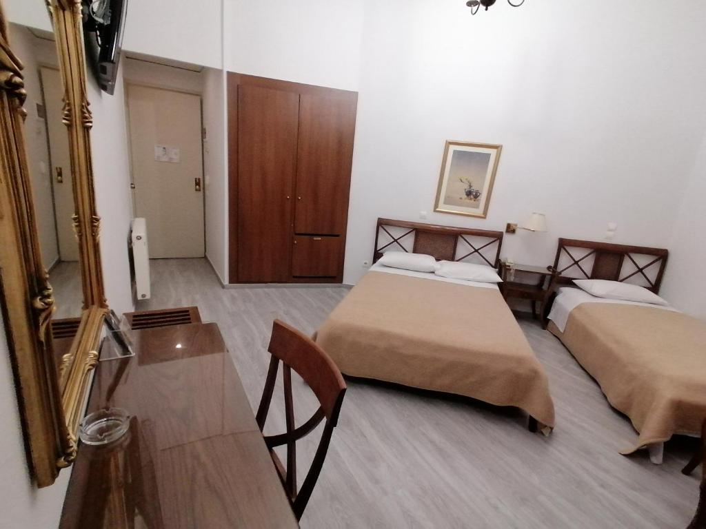 Postel nebo postele na pokoji v ubytování Hotel Galaxias