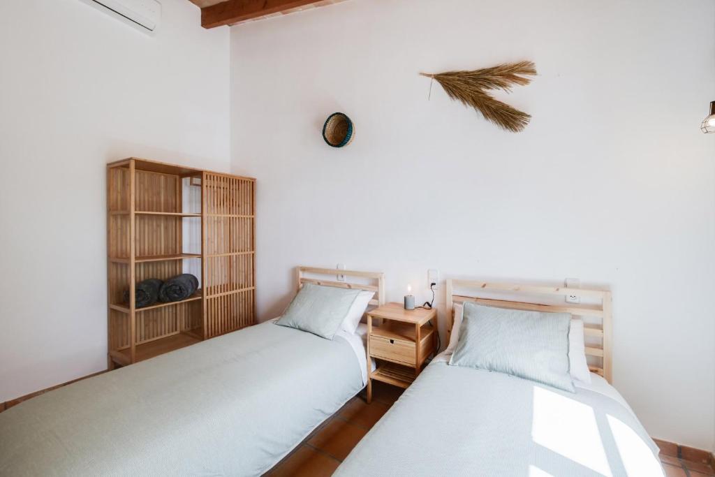 Postel nebo postele na pokoji v ubytování Finca Calderitx