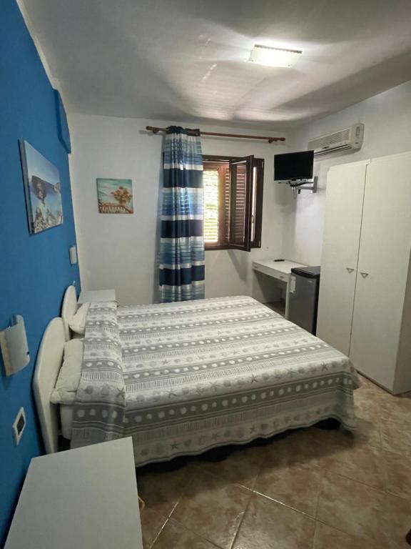 Postel nebo postele na pokoji v ubytování Il veliero blu camere sul porto