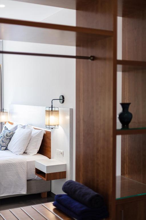 A bed or beds in a room at Sea View Suite "Hara" - Adults Only