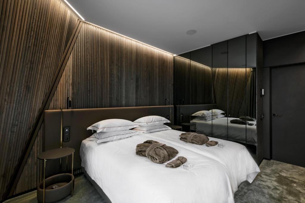 Ein Bett oder Betten in einem Zimmer der Unterkunft Mana Sleep &amp; Spa