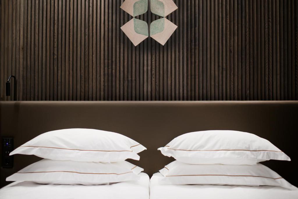 Ein Bett oder Betten in einem Zimmer der Unterkunft Mana Sleep &amp; Spa