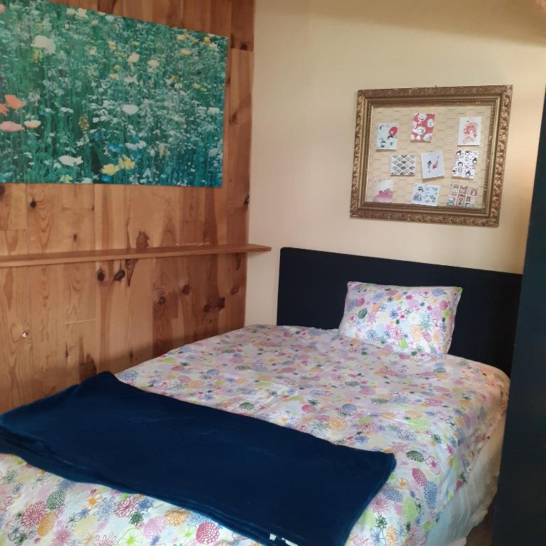 Postel nebo postele na pokoji v ubytování Les deux arches