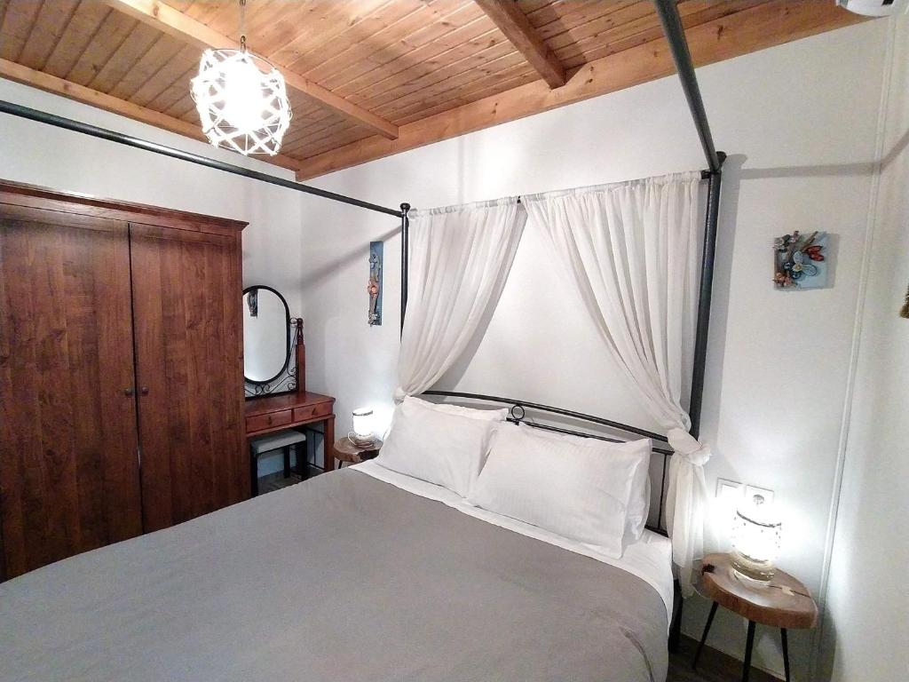 Postel nebo postele na pokoji v ubytování Rustic House