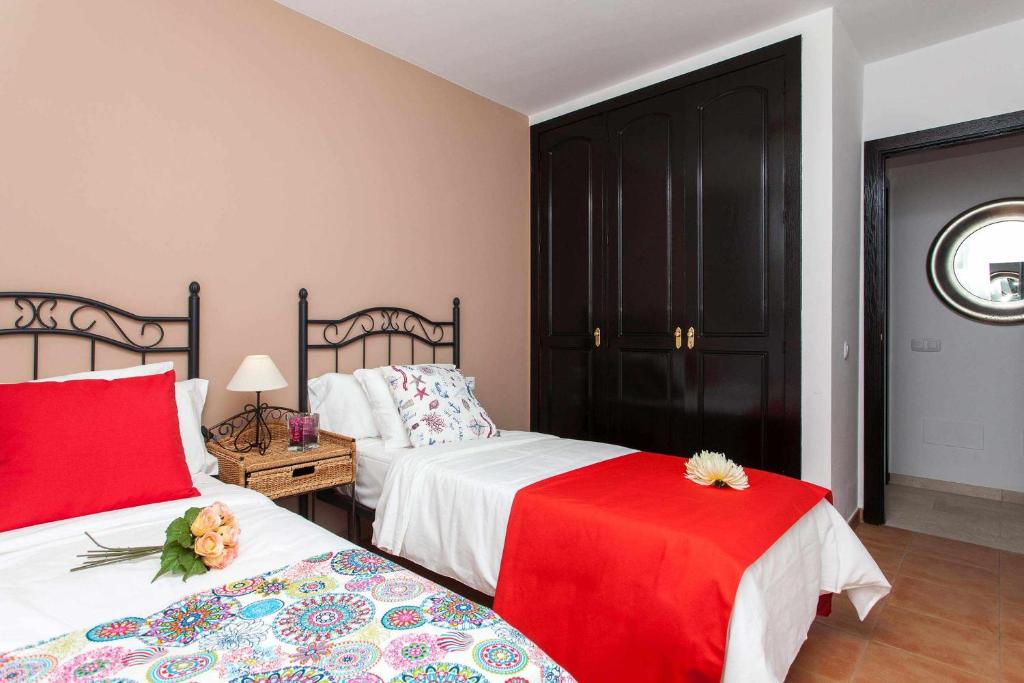 Postel nebo postele na pokoji v ubytování Casa Royal Park by Vacanzy Collection