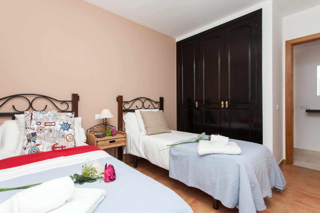 Postel nebo postele na pokoji v ubytování Casa Royal Park by Vacanzy Collection