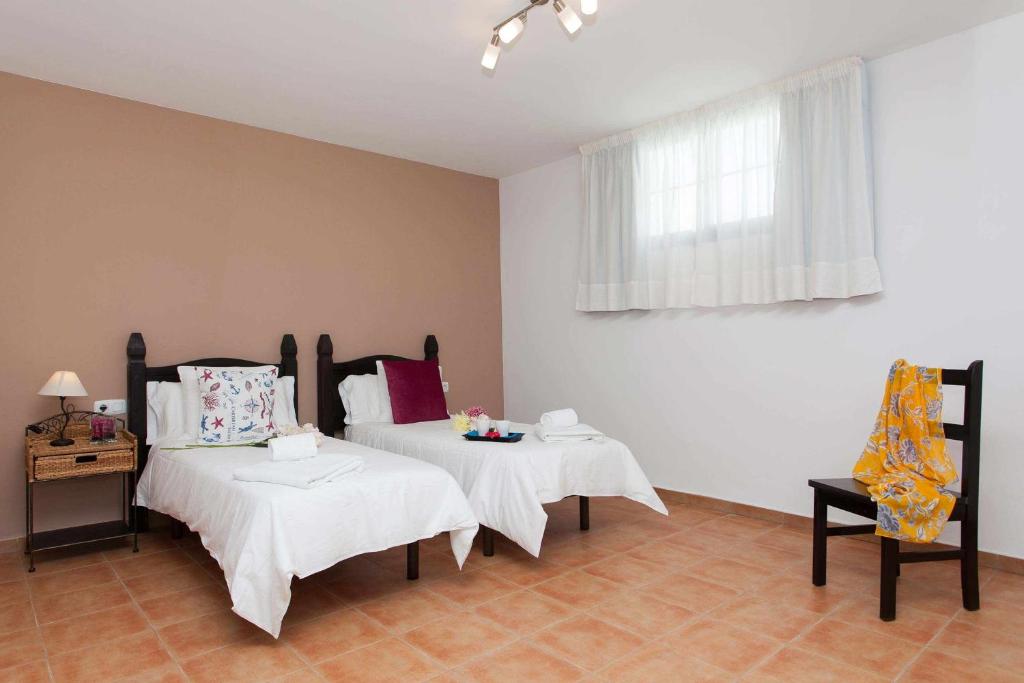Postel nebo postele na pokoji v ubytování Casa Royal Park by Vacanzy Collection